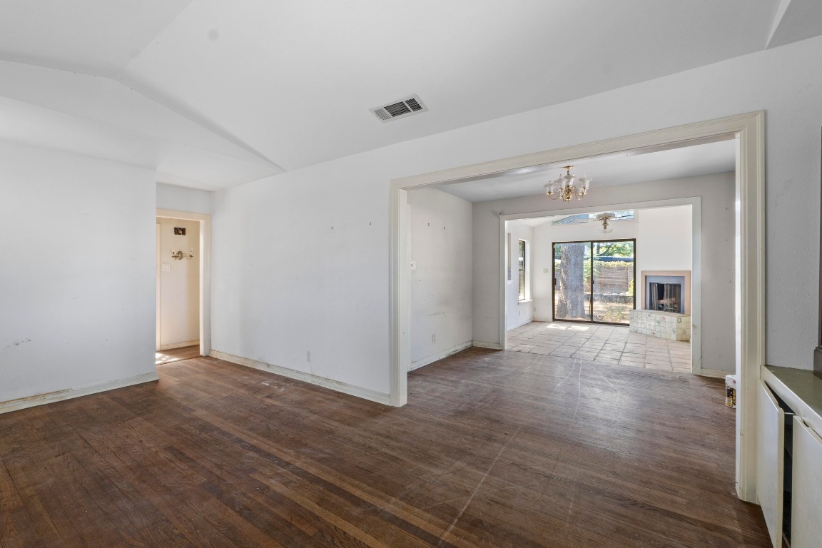 1811 Palma Plaza Austin, TX 78703 - Photo 5 of 17 an empty room with wooden floor and windows