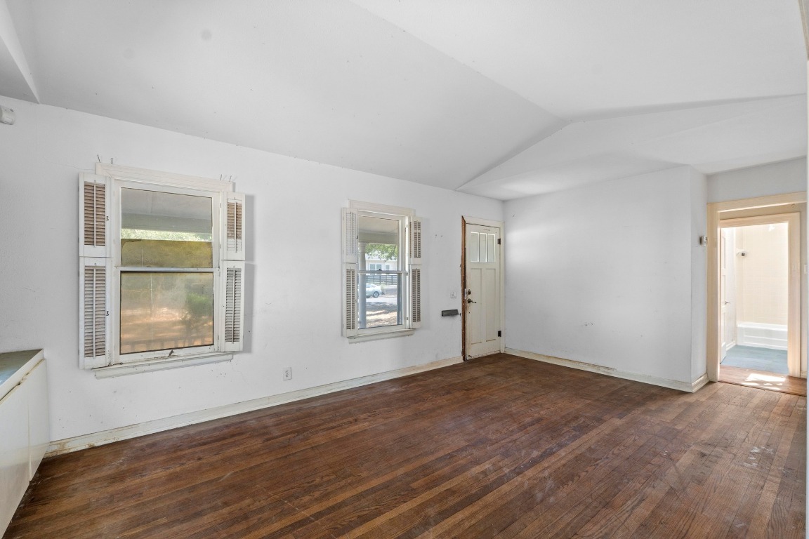 1811 Palma Plaza Austin, TX 78703 - Photo 6 of 17 an empty room with wooden floor and windows