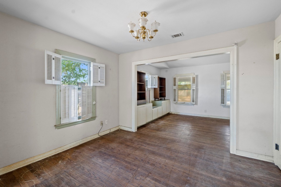 1811 Palma Plaza Austin, TX 78703 - Photo 7 of 17 an empty room with wooden floor and windows