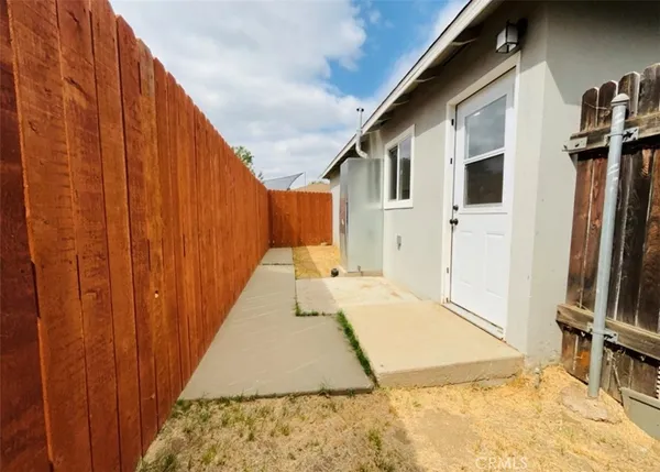 a view of a front door and wooden floor