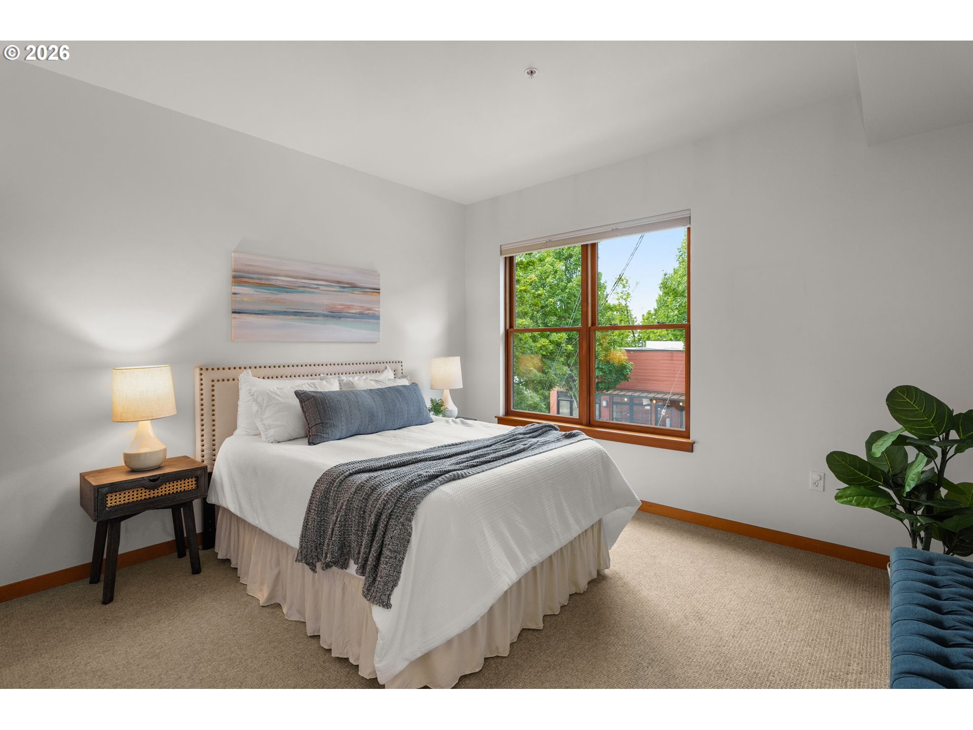 2350 Northwest Savier Street, Unit 224 Portland, OR 97210 - Photo 10 of 19 a bedroom with a bed table and a window