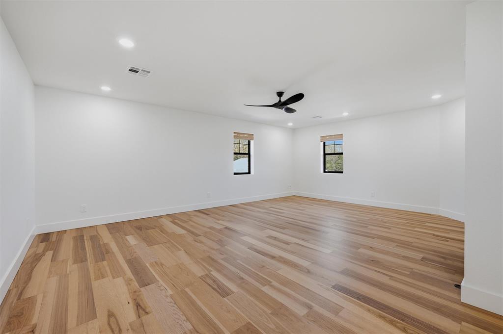 1805 Arthur Road Denison, TX 75021 - Photo 26 of 40 a view of empty room with wooden floor and fan