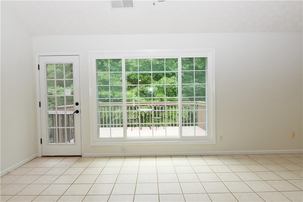 795 Sunset Ridge Lane Southeast Lawrenceville, GA 30045 - Photo 13 of 47 a view of an empty room with a window