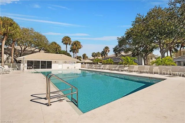 a view of a chair and tables in the patio