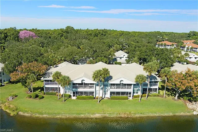 an aerial view of a house with a yard and garden