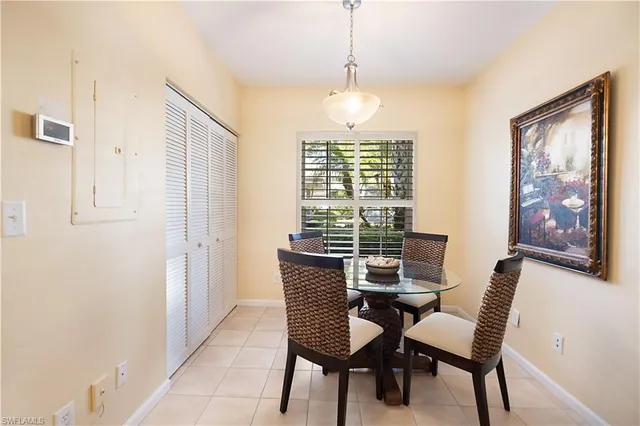 a view of a dining room with furniture window and outside view