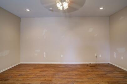 2601 33rd Street, Unit REAR Lubbock, TX 79410 - Photo 2 of 16 a view of an empty room with window and wooden floor