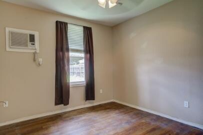 2601 33rd Street, Unit REAR Lubbock, TX 79410 - Photo 10 of 16 an empty room with windows