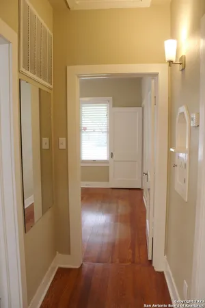 a view of a bathroom from a hallway