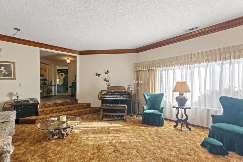 3414 Royal Road Vista, CA 92084 - Photo 21 of 48 a living room with furniture and a window