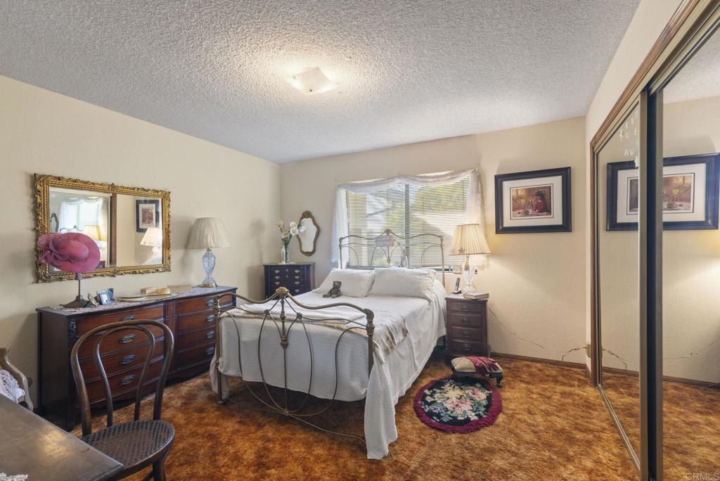 3414 Royal Road Vista, CA 92084 - Photo 23 of 48 a bed room with a bed and a painting on the wall