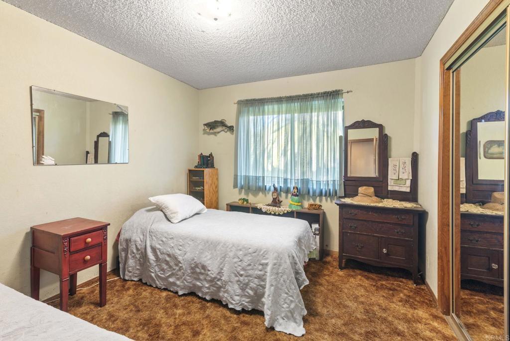 3414 Royal Road Vista, CA 92084 - Photo 24 of 48 a bedroom with a bed and a tv on dresser
