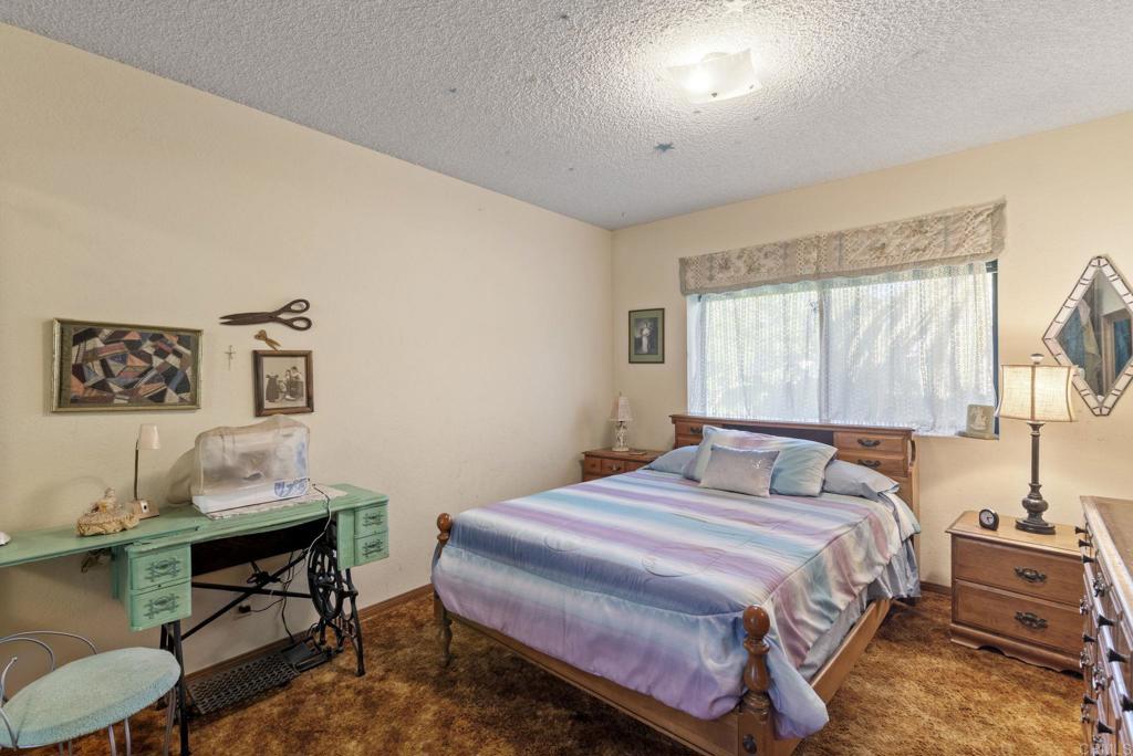 3414 Royal Road Vista, CA 92084 - Photo 25 of 48 a bedroom with a bed and a table