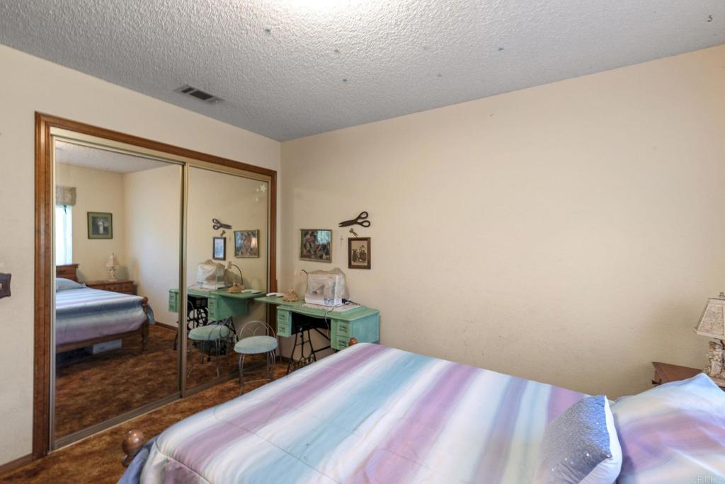 3414 Royal Road Vista, CA 92084 - Photo 26 of 48 a bedroom with a bed and a desk