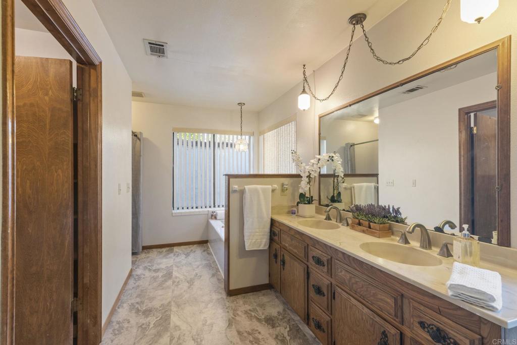 3414 Royal Road Vista, CA 92084 - Photo 30 of 48 a bathroom with a sink double vanity and a mirror