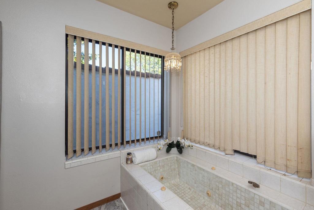 3414 Royal Road Vista, CA 92084 - Photo 31 of 48 a view of a bathroom with a tub and sink