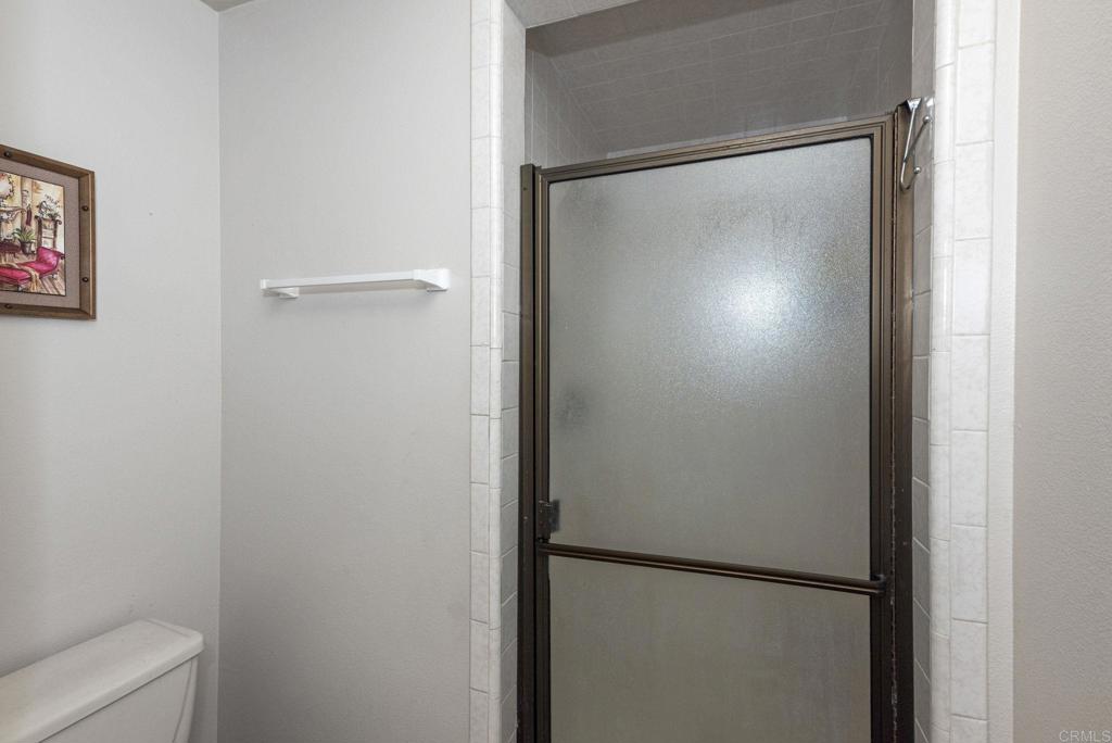 3414 Royal Road Vista, CA 92084 - Photo 32 of 48 a bathroom with a glass shower door