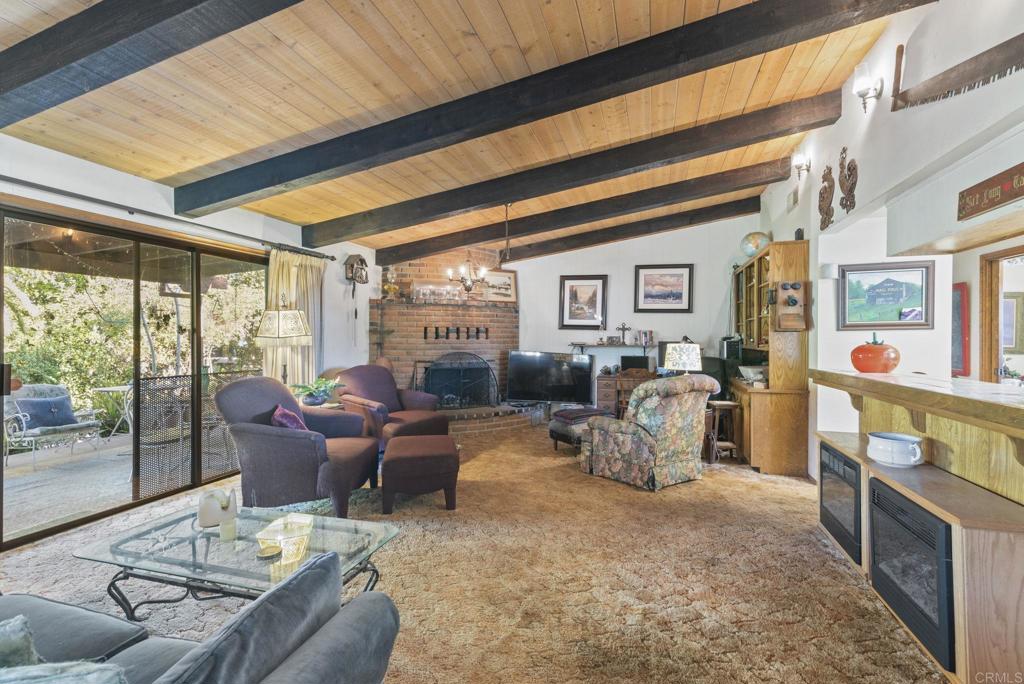 3414 Royal Road Vista, CA 92084 - Photo 10 of 48 a living room with furniture fireplace and a large window