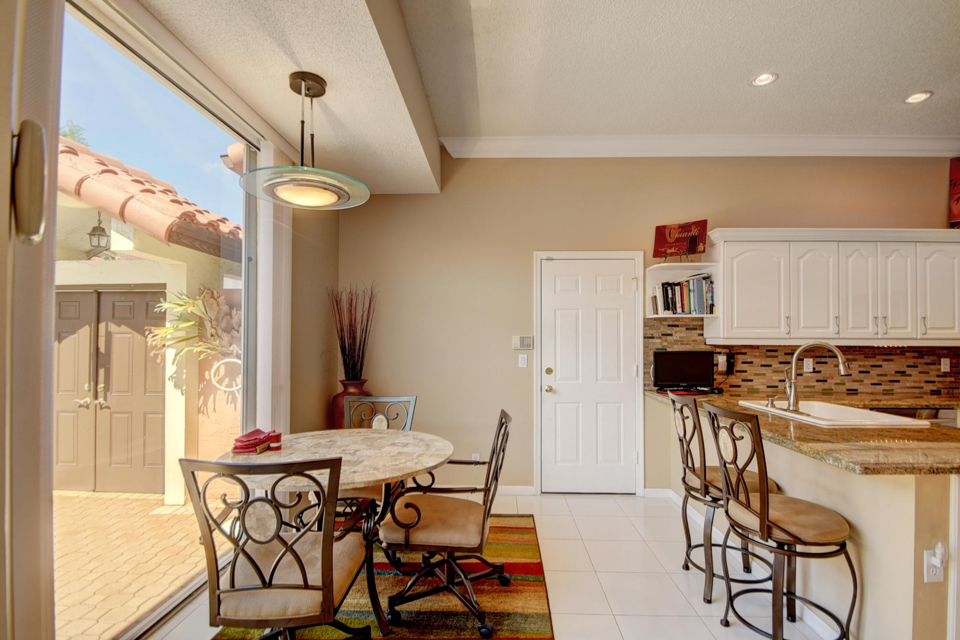 23180 Via Stel Boca Raton, FL 33433 - Photo 8 of 24 kitchen with Breakfast Area