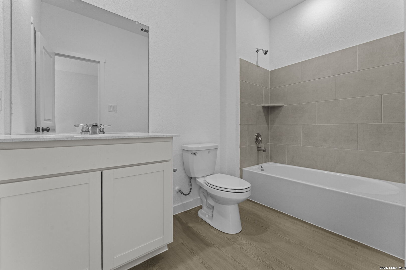 4987 Mission Tejas Road Marion, TX 78124 - Photo 12 of 25 a bathroom with a toilet sink vanity tub and mirror