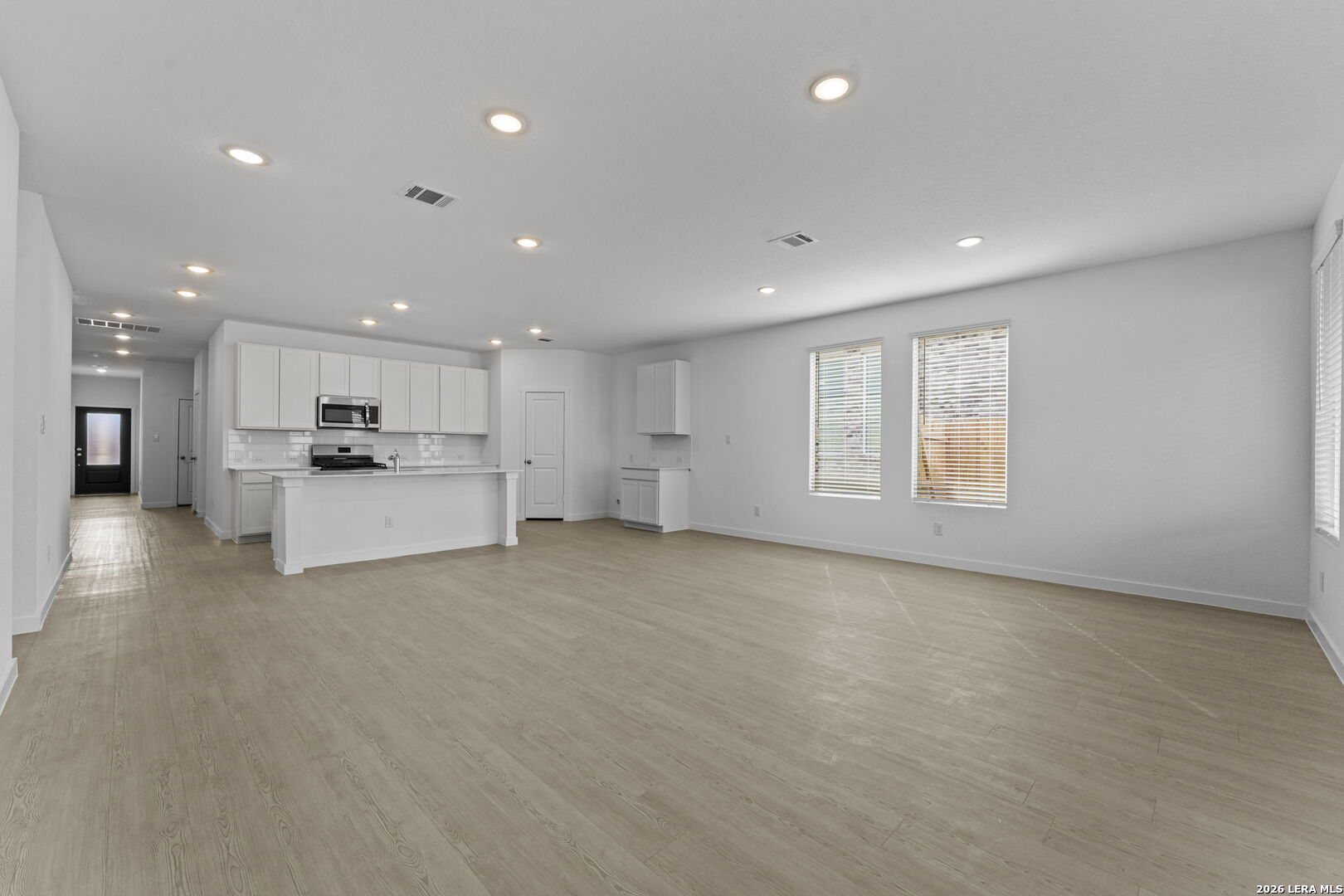 4987 Mission Tejas Road Marion, TX 78124 - Photo 19 of 25 a view of a kitchen with a sink wooden cabinets and a window
