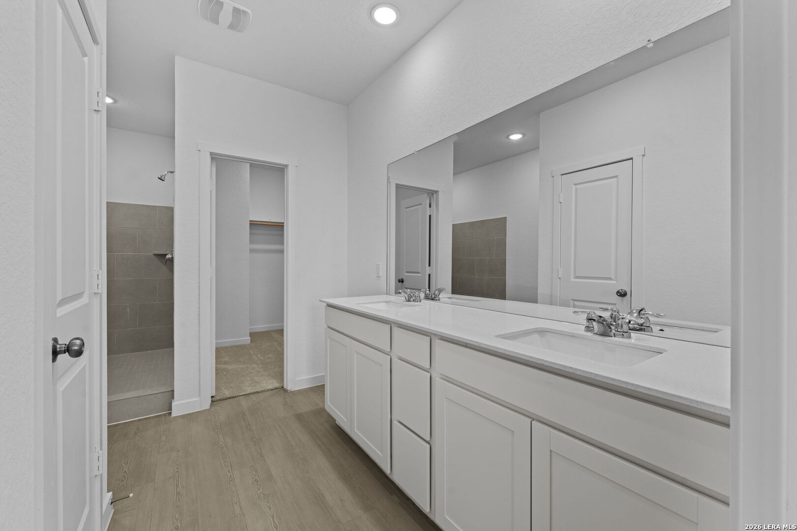 4987 Mission Tejas Road Marion, TX 78124 - Photo 22 of 25 a spacious bathroom with a double vanity sink and mirror