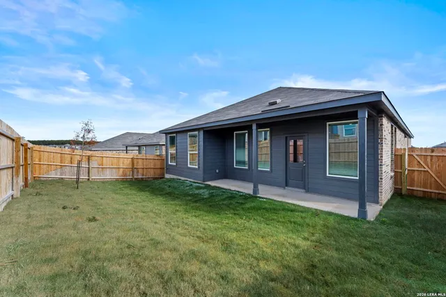 a backyard of a house with lots of green space
