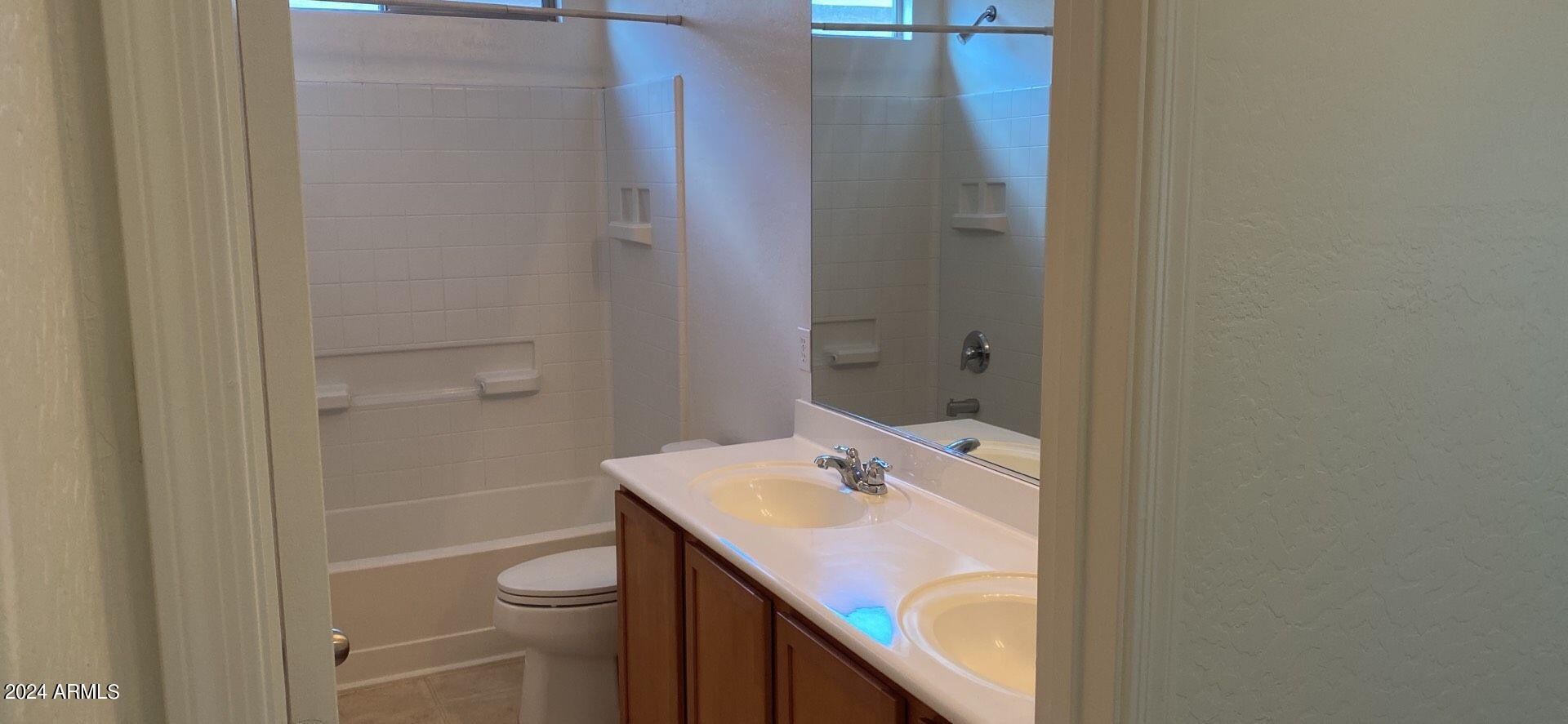 5257 West Shumway Farm Road Laveen, AZ 85339 - Photo 11 of 13 a bathroom with a sink toilet and tub