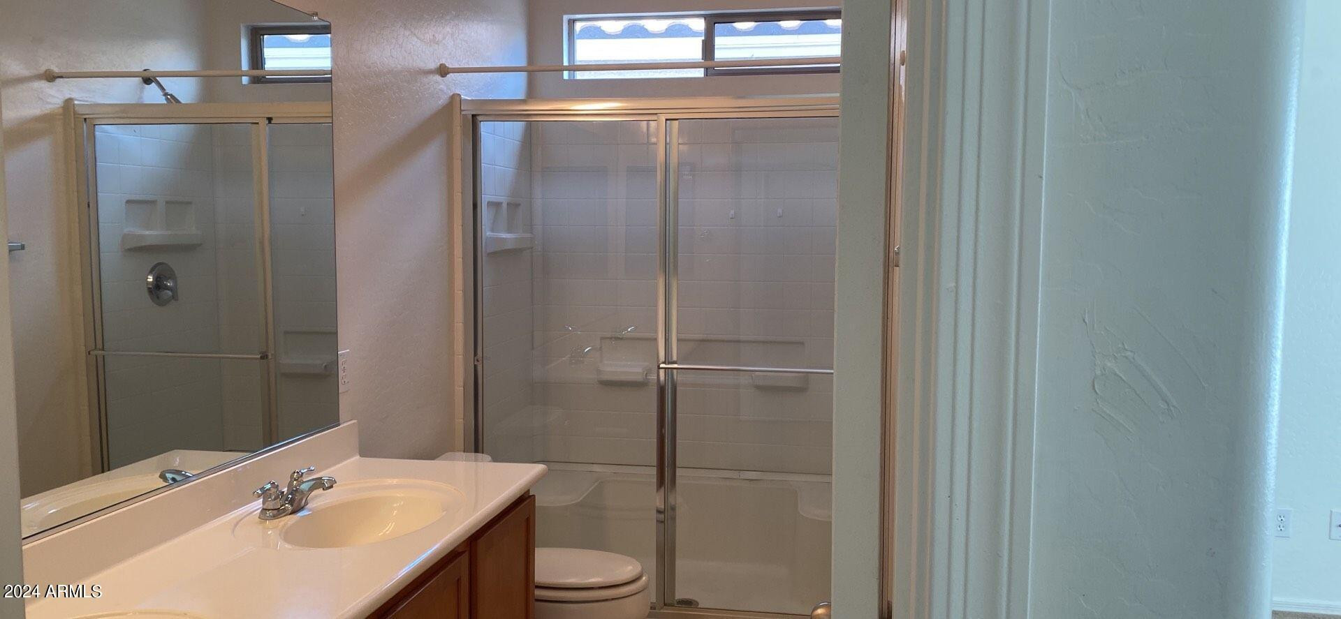 5257 West Shumway Farm Road Laveen, AZ 85339 - Photo 12 of 13 a bathroom with a sink a toilet and shower