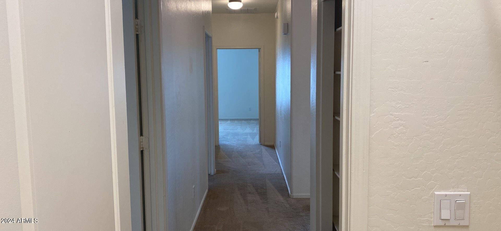5257 West Shumway Farm Road Laveen, AZ 85339 - Photo 13 of 13 a view of a hallway with wooden floor