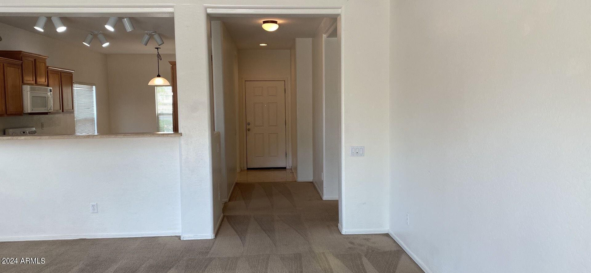 5257 West Shumway Farm Road Laveen, AZ 85339 - Photo 4 of 13 a view of a hallway with wooden floor