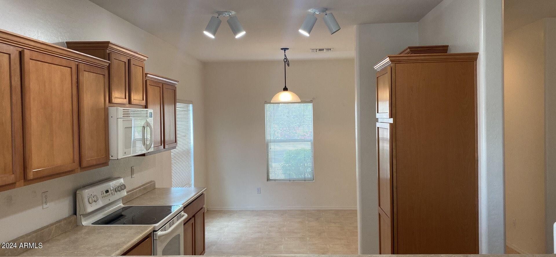 5257 West Shumway Farm Road Laveen, AZ 85339 - Photo 5 of 13 a bathroom with a shower a mirror and a window