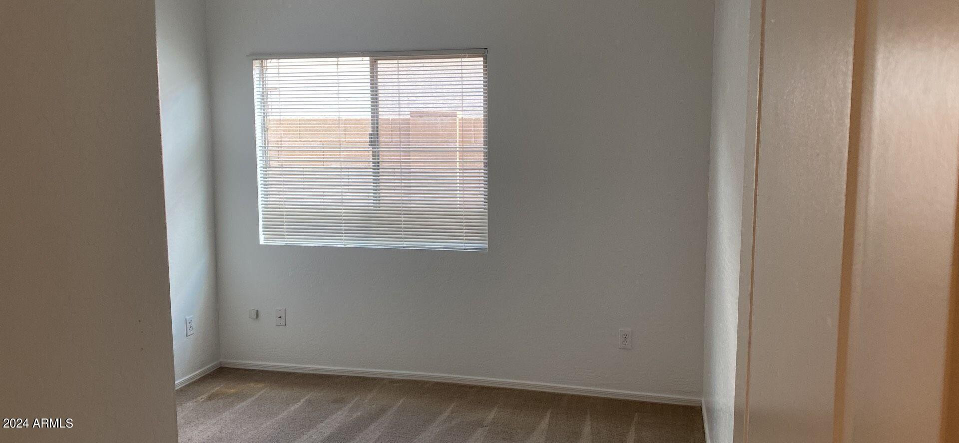 5257 West Shumway Farm Road Laveen, AZ 85339 - Photo 8 of 13 a view of an empty room with a window