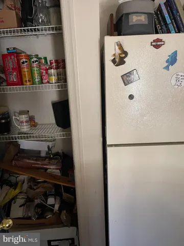 a white refrigerator freezer sitting inside of a kitchen