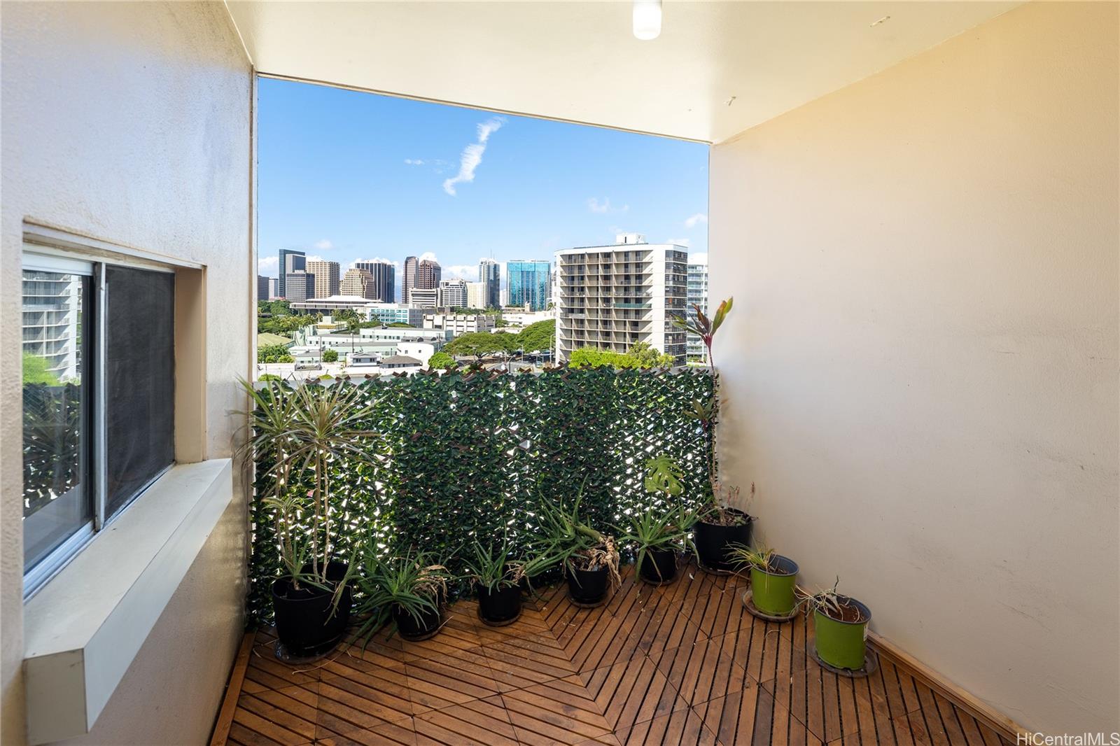 785 Kinau Street, Unit 804 Honolulu, HI 96813 - Photo 12 of 16 a balcony with wooden floor and outdoor seating