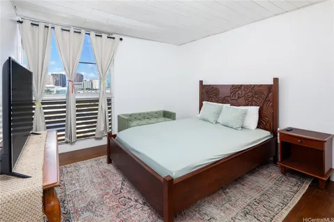 a bedroom with a bed and a walk in closet