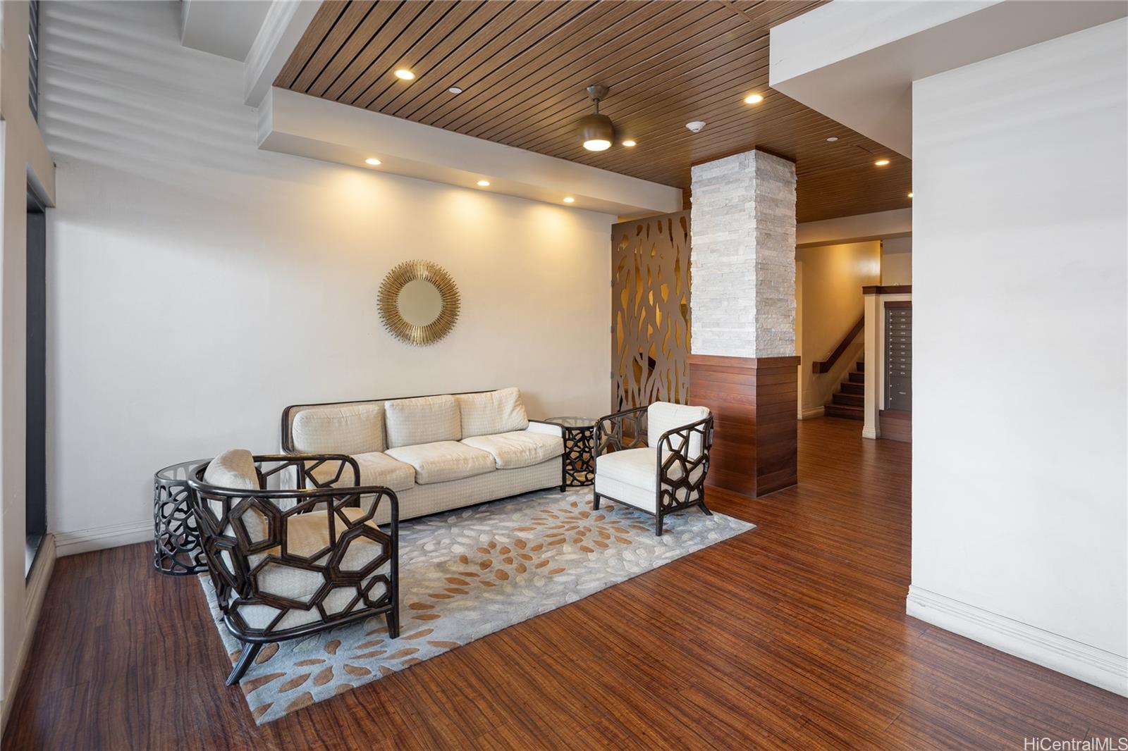 785 Kinau Street, Unit 804 Honolulu, HI 96813 - Photo 3 of 16 a living room with furniture and wooden floor