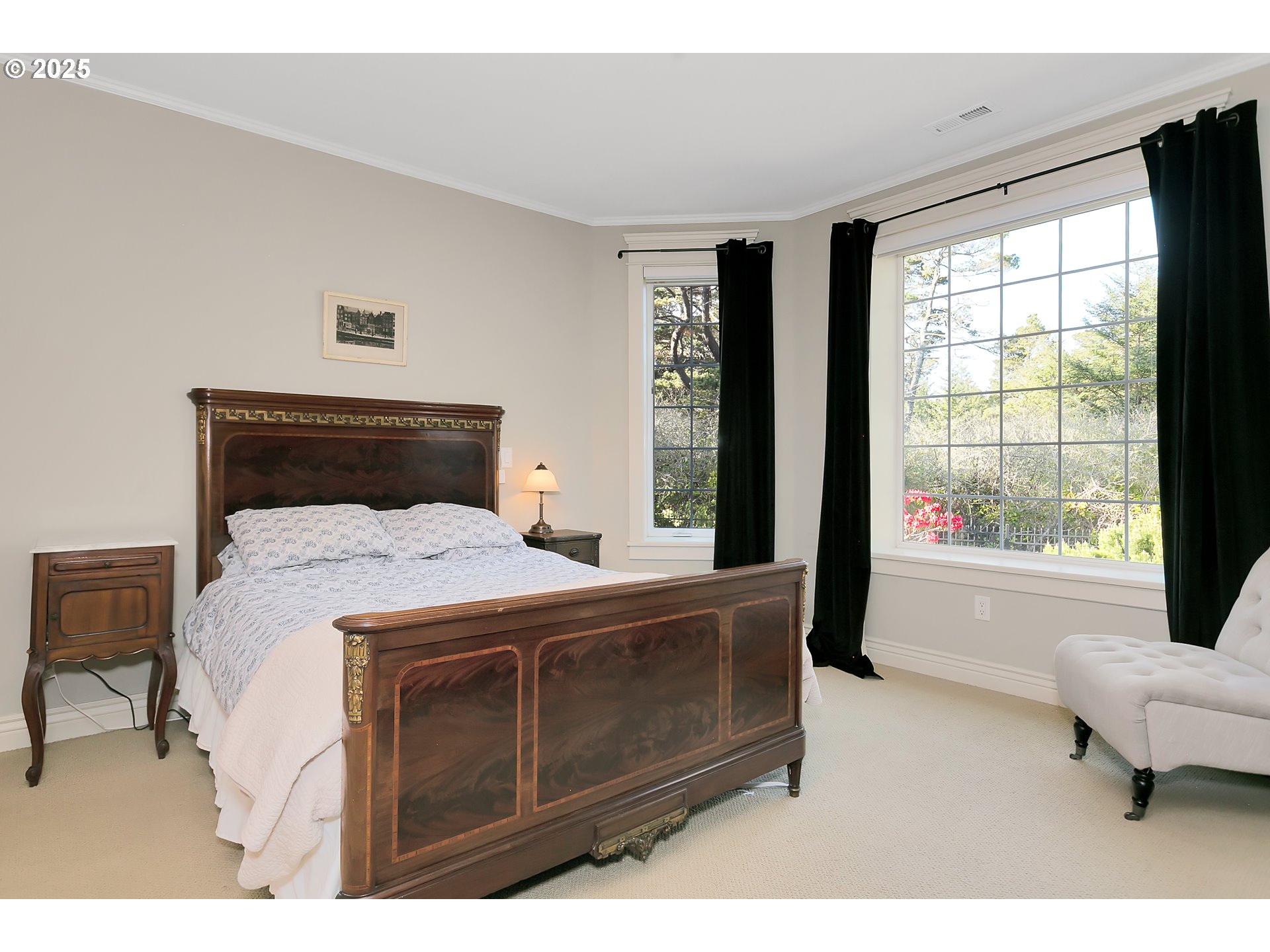 160 Southwest 59th Street South Beach, OR 97366 - Photo 20 of 45 a bedroom with a large bed and a large window