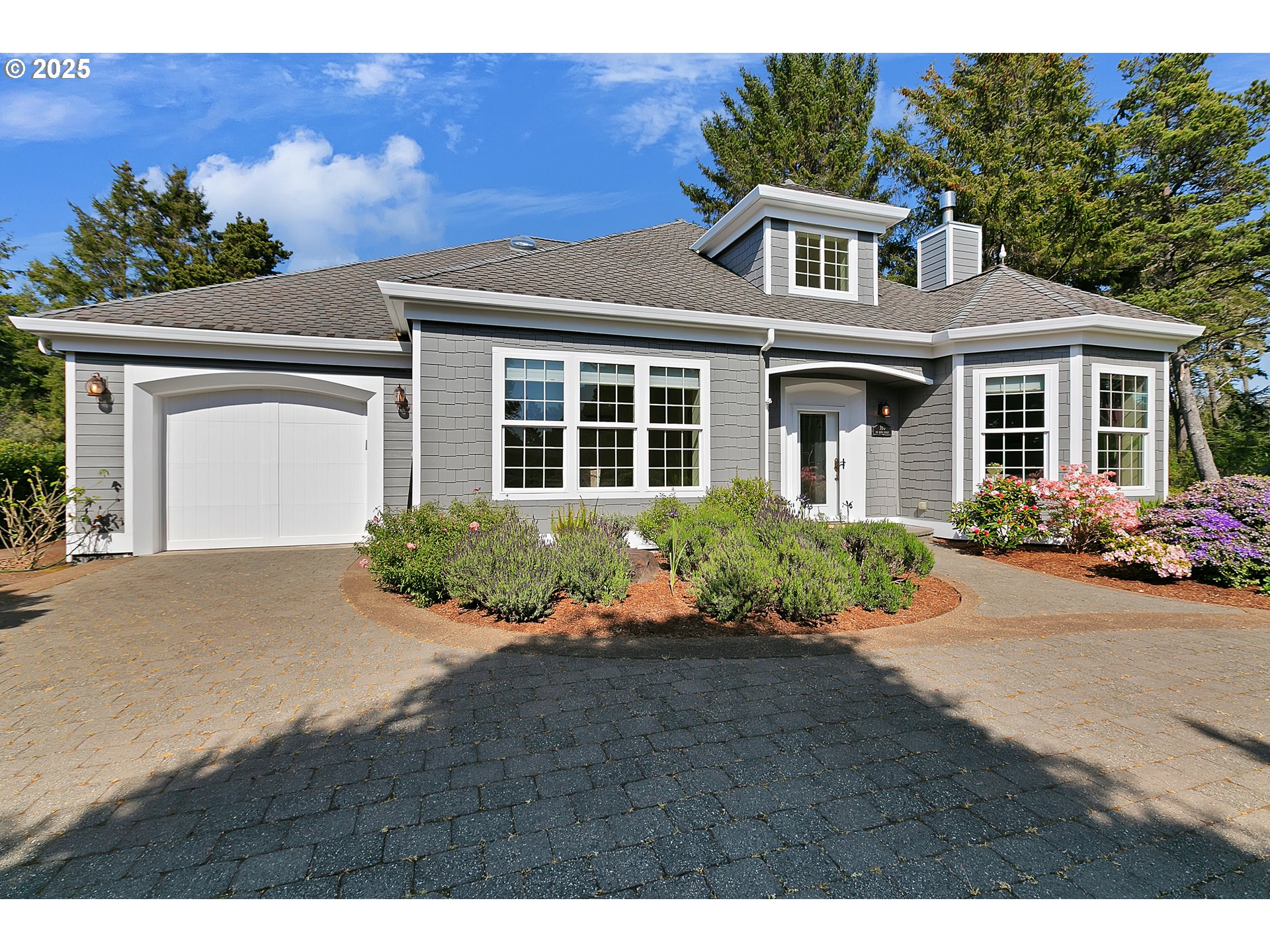 160 Southwest 59th Street South Beach, OR 97366 - Photo 2 of 45 a front view of a house with a yard and potted plants
