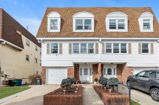 a front view of a house with outdoor space