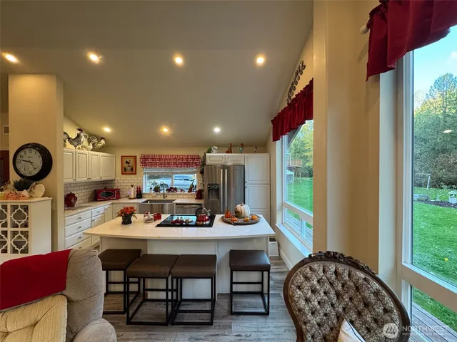 a very nice looking dining room with a table and chairs