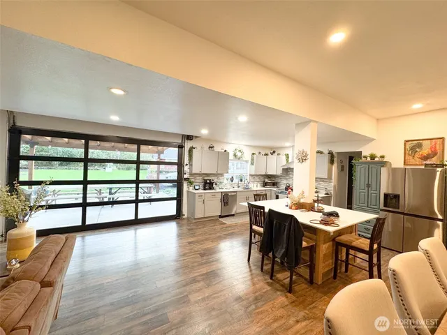 a view of a dining room with furniture window and wooden floor