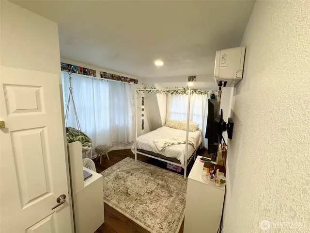 a bed room with a bed and a window