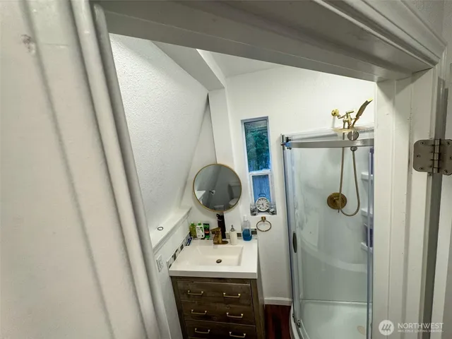 a bathroom with a sink and mirror