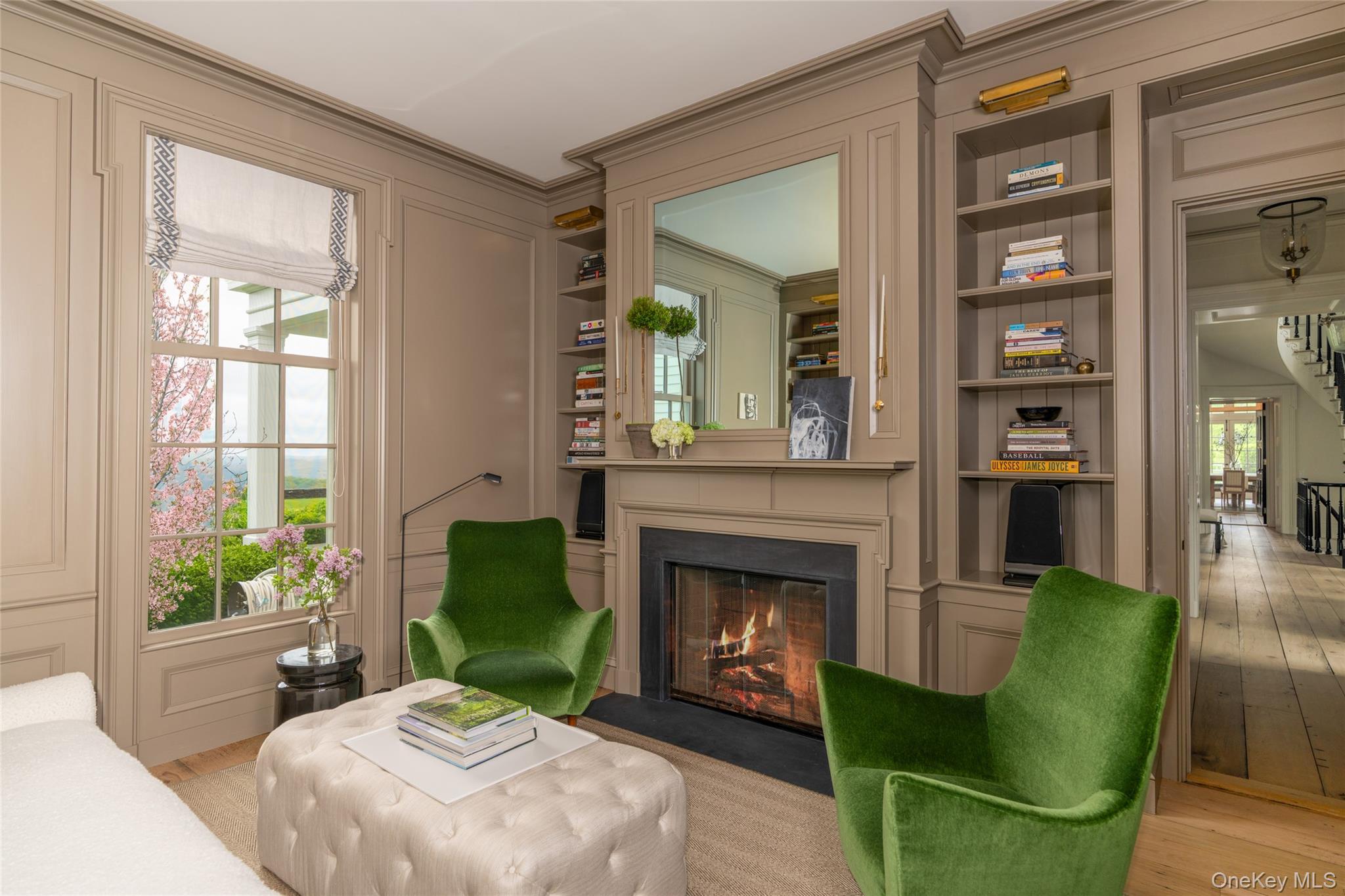 1190 Chestnut Ridge Road Dover Plains, NY 12522 - Photo 12 of 42 Sitting room featuring built in features, light wood-style flooring, a fireplace with flush hearth, crown molding, and stairway