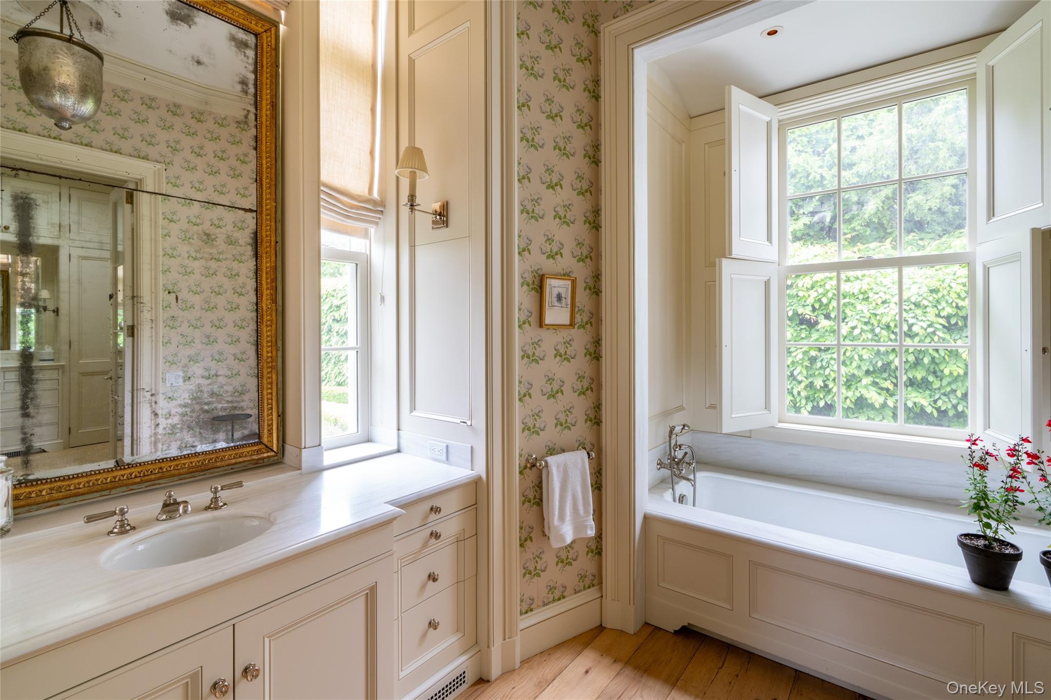 1190 Chestnut Ridge Road Dover Plains, NY 12522 - Photo 17 of 42 Bathroom featuring vanity, a bath, plenty of natural light, wood-type flooring, and wallpapered walls