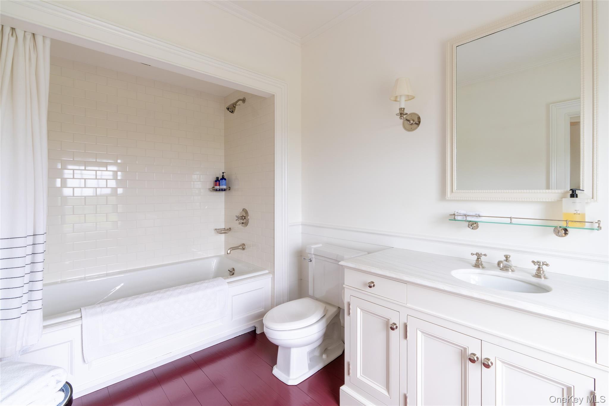 1190 Chestnut Ridge Road Dover Plains, NY 12522 - Photo 23 of 42 Full bath featuring vanity, shower / bath combo with shower curtain, crown molding, and wood finished floors