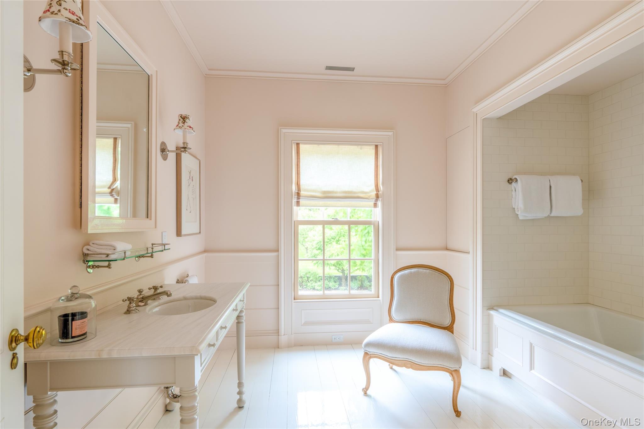 1190 Chestnut Ridge Road Dover Plains, NY 12522 - Photo 25 of 42 Full bath with wainscoting, crown molding, vanity, a decorative wall, and wood finished floors