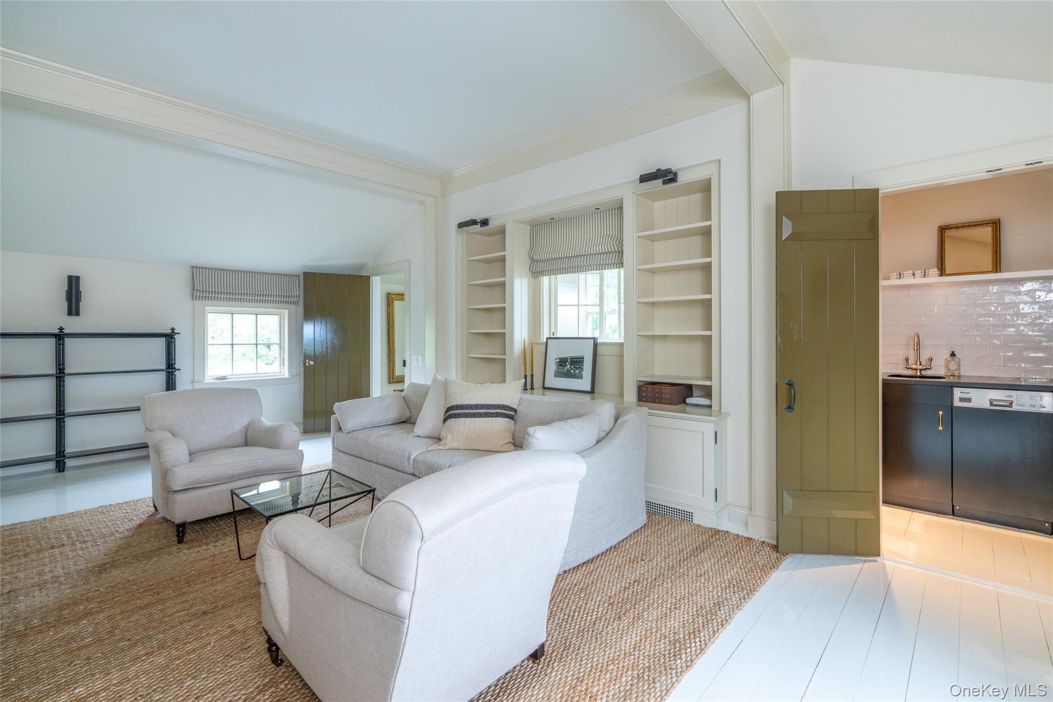 1190 Chestnut Ridge Road Dover Plains, NY 12522 - Photo 26 of 42 Living room featuring healthy amount of natural light, wet bar, and built in shelves
