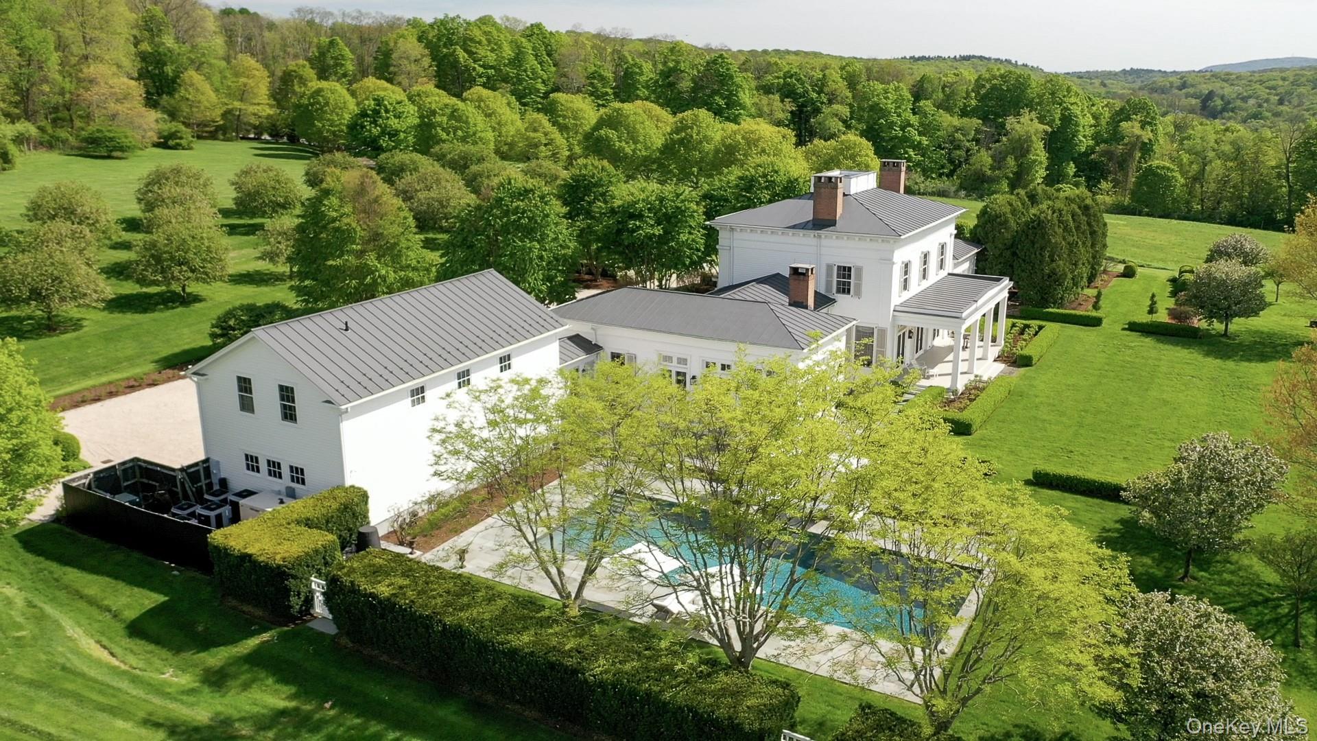 1190 Chestnut Ridge Road Dover Plains, NY 12522 - Photo 42 of 42 View from above of property with a pool area and a forest